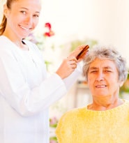 Caregiver helping with grooming